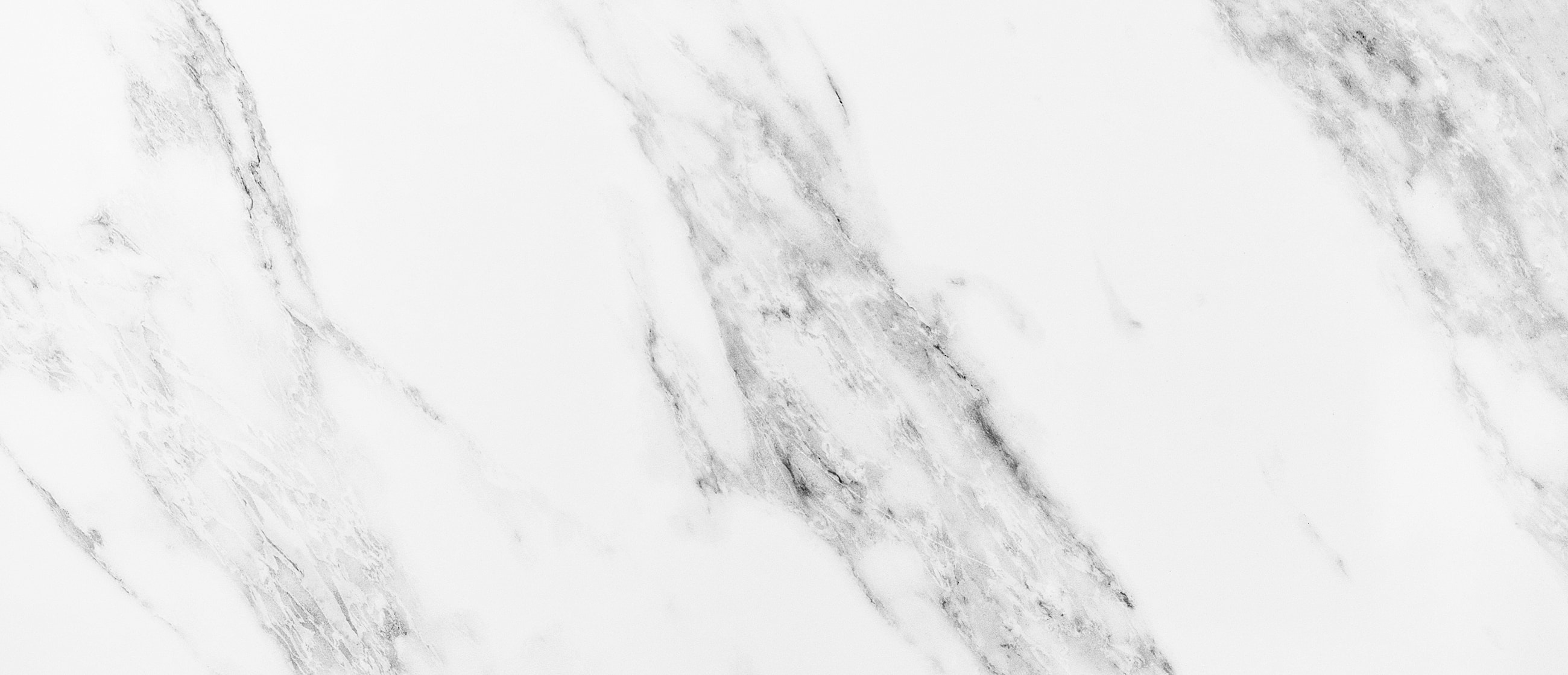 White marble surface with gray veining pattern.
