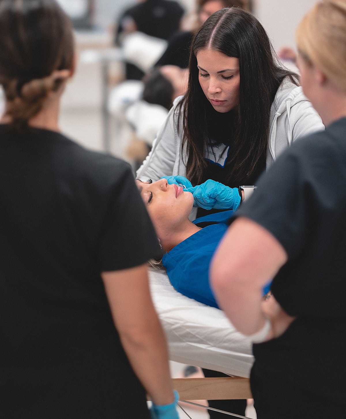 Training session for cosmetic procedures in progress.