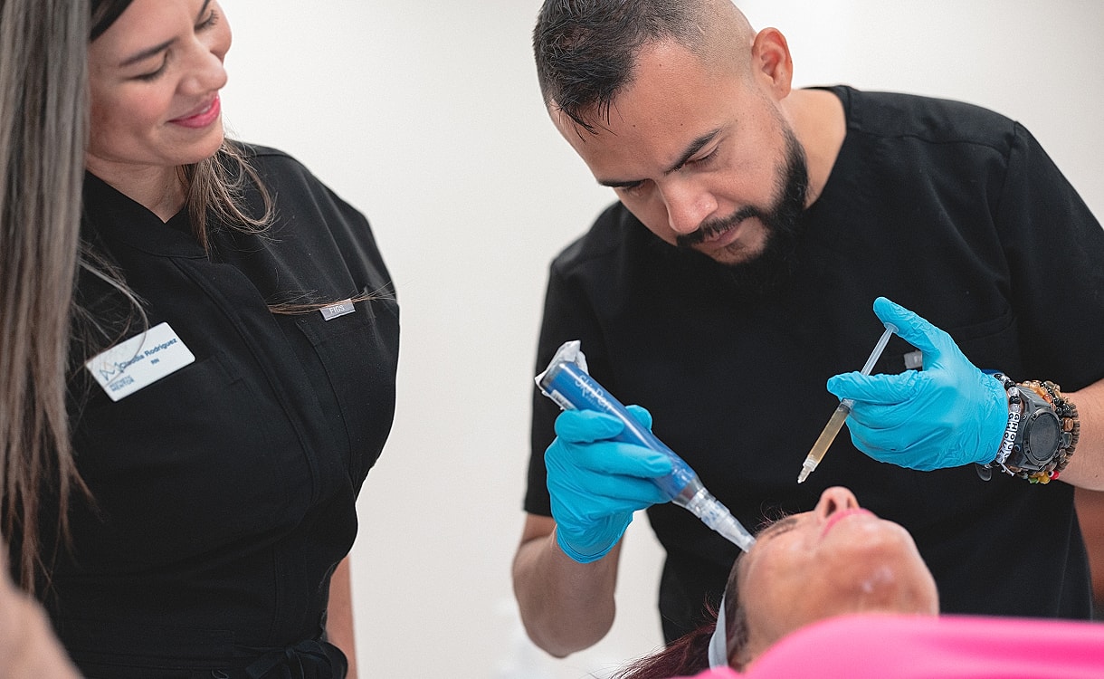 Cosmetic procedure in progress with professionals assisting.