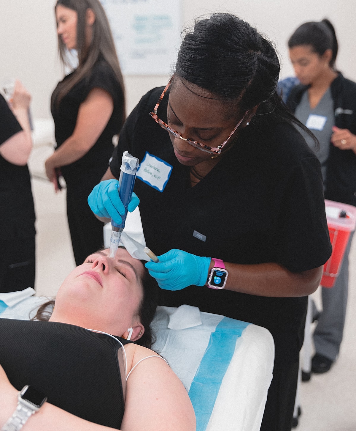 Medical professional preparing a syringe for injection.