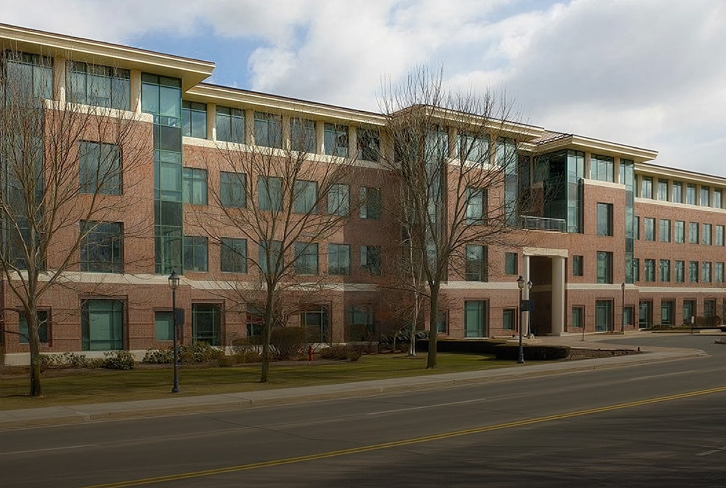 Brick office building with large windows.