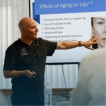 Doctor presenting on aging effects on lips.