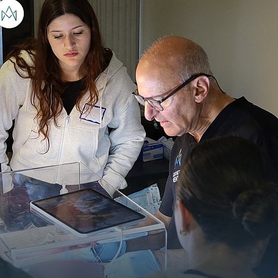 Medical professionals engaging in hands-on training.
