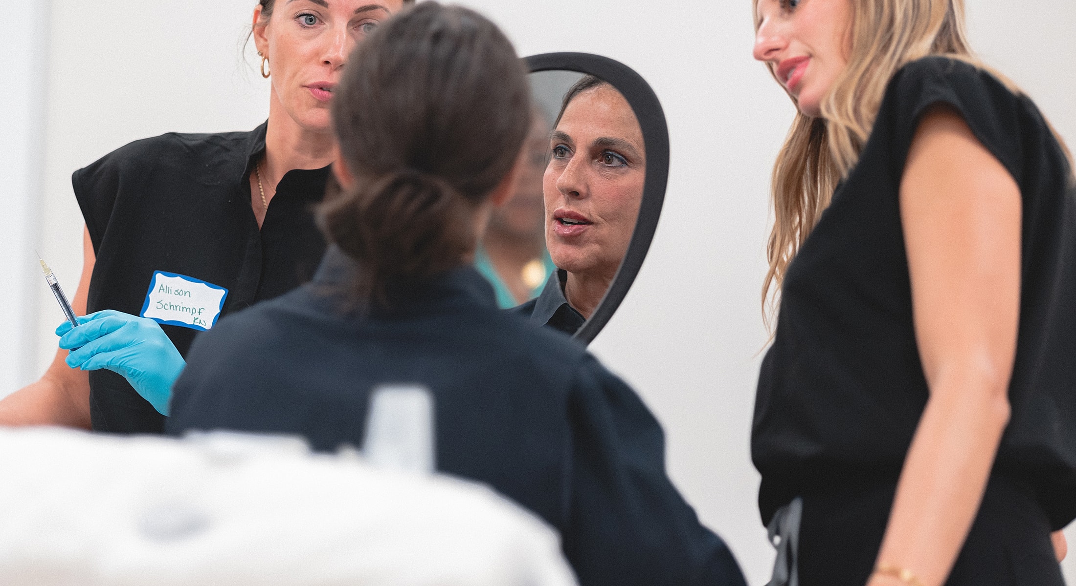 Health professionals discussing treatment in a clinic.