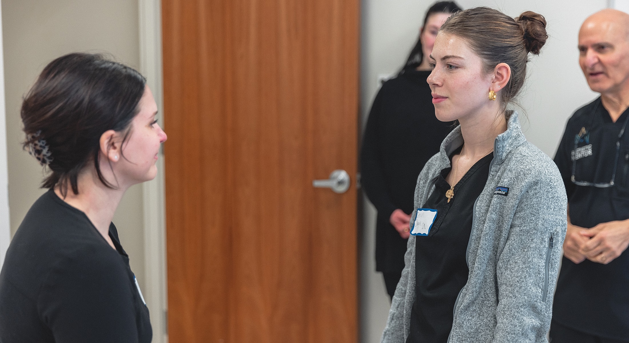 Practitioner performing cosmetic treatment on client.