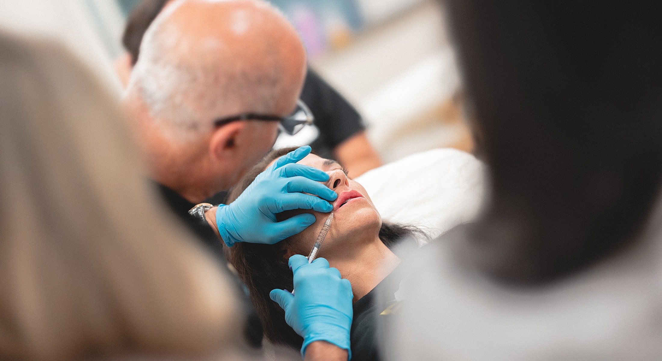 Administering cosmetic treatment in a clinical setting