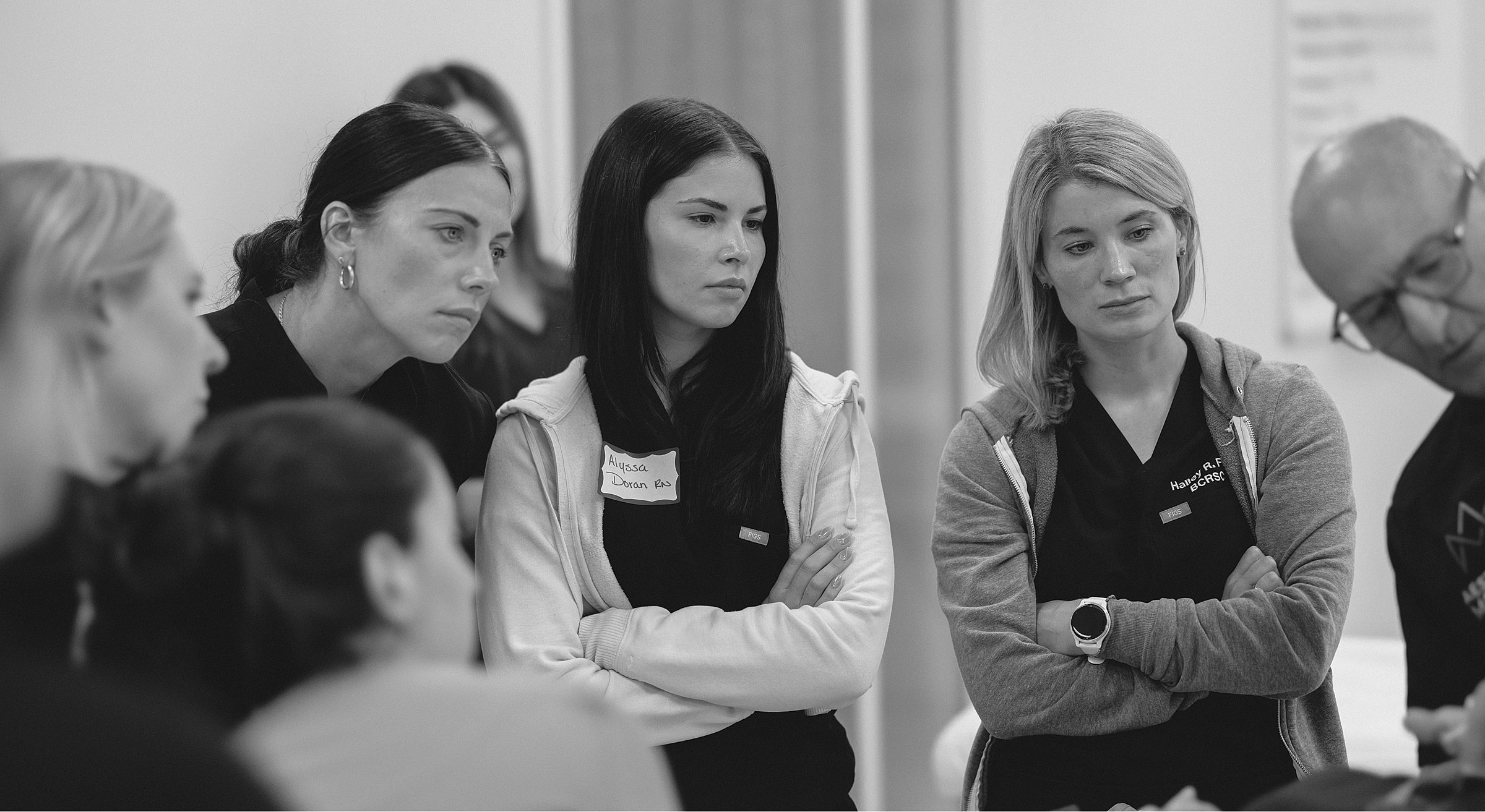 Group of women attentively listening in discussion.